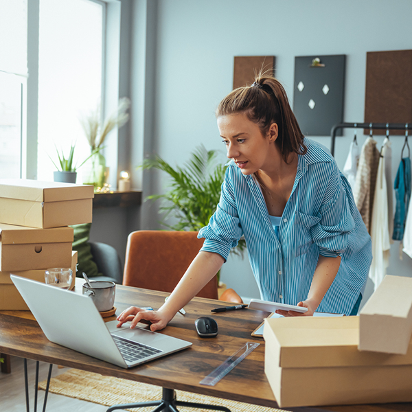 owner of small business adding new products to website