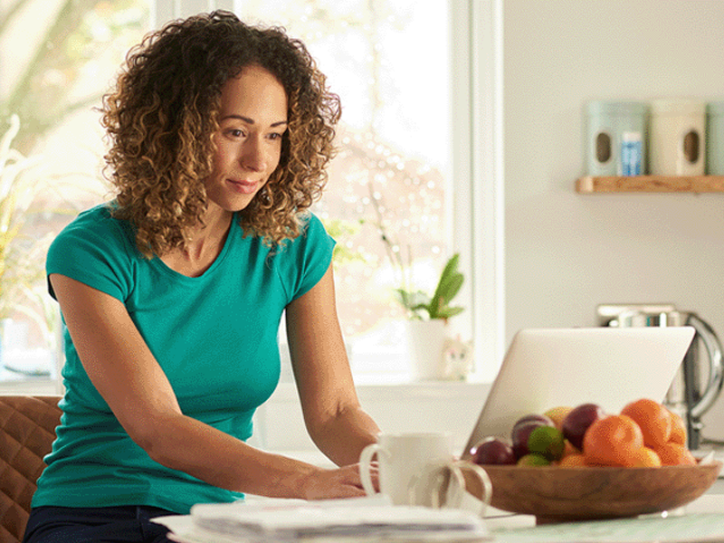 person searching for a domain name on a laptop