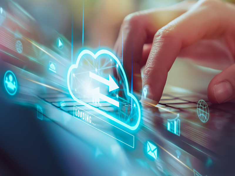 Hand using laptop with upload data on internet storage.